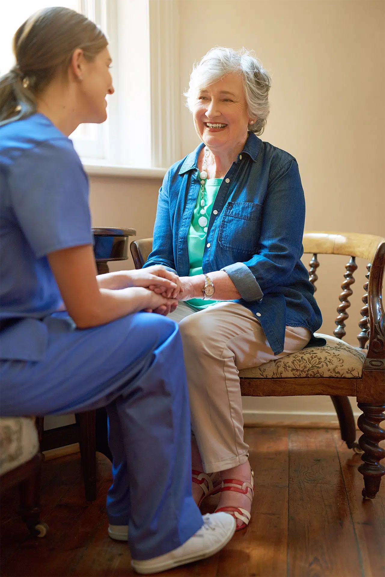 Caregiver helping a client with a daily activity at home