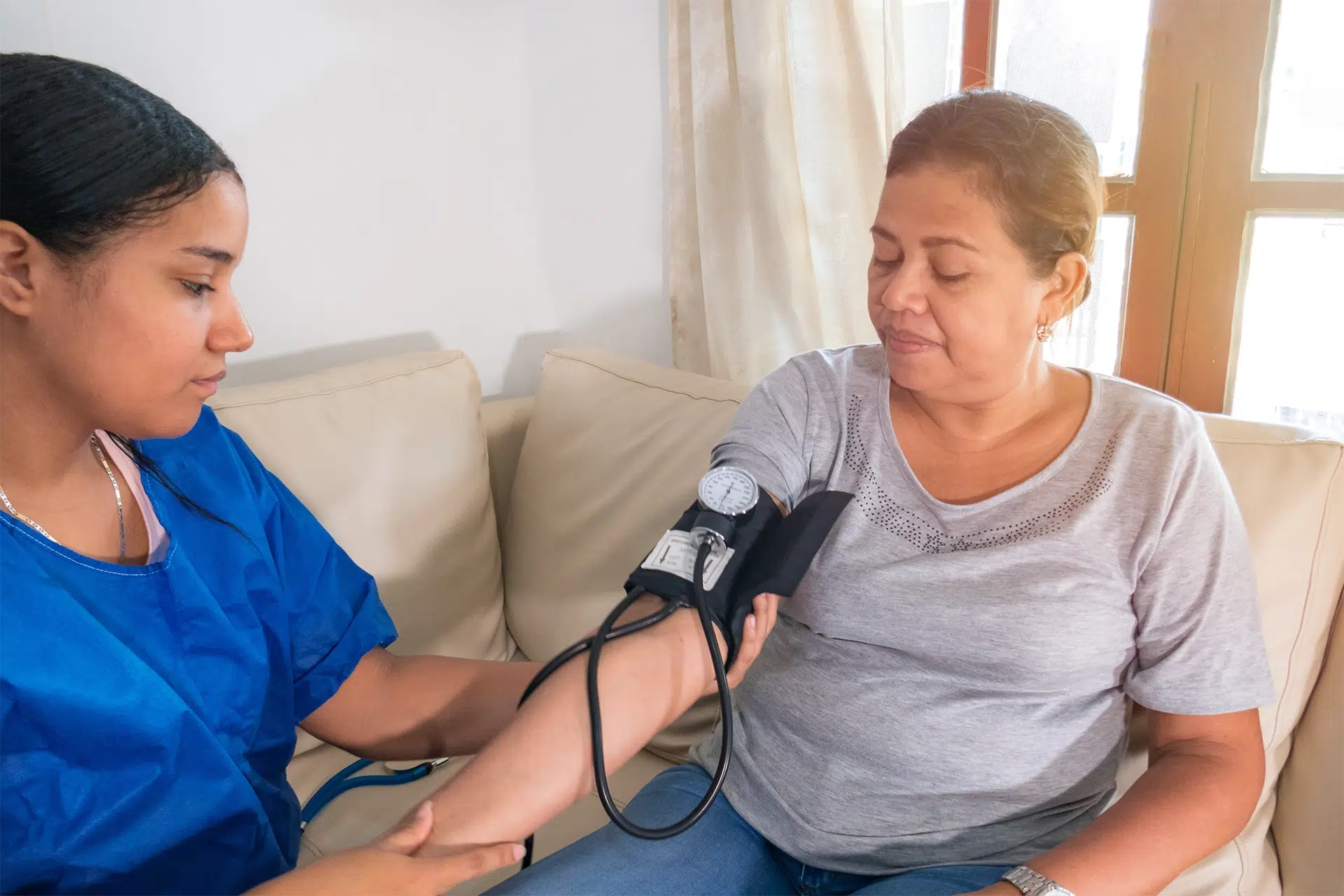 Caregiver helping an older client at home